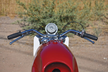 rider view of the handlebars of the red BSA Gold Star with the speedometer in…